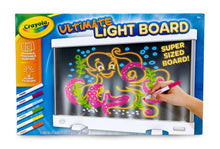 LED light board toy with glowing tracing screen and colored crayon, in use