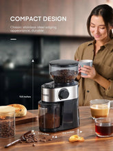 Compact electric coffee grinder with clear bean hopper and grind control dial