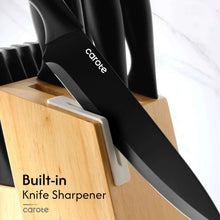 Black ceramic-coated knife using a built-in sharpener on the wooden block