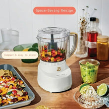 White 3-cup food chopper with clear bowl and chopping blade, handle on side