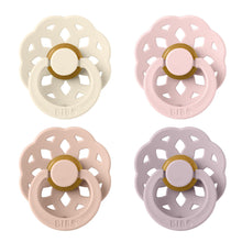 BIBS Boheme latex pacifiers in ivory, pink, peach, and lilac with round shields and ring handles