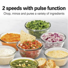 Black chopper with clear cups of mixed chopped ingredients for chopping or pureeing