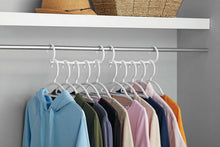 White cascading foldable clothing hangers with rounded clips along the bar