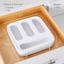 White plastic food bag dispenser with four slots on open tray