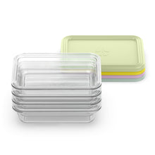 Clear glass meal prep containers with pale green lid, nested in stack