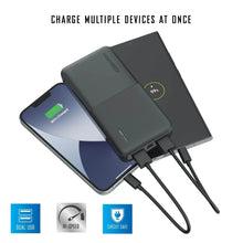 Black power bank powering multiple devices at once with dual USB ports
