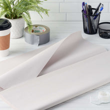 Large white packing paper sheet laid flat for wrapping items