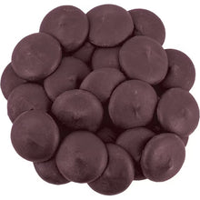 Pile of dark chocolate candy wafers, round pieces