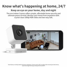 Indoor wired security camera with white housing and black lens on tabletop stand
