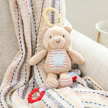 Light-up plush bear toy with striped chest panel and red ring pull clip