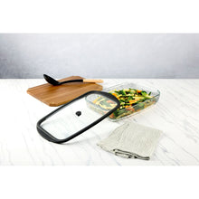 Glass baking dish with lid, vegetable bake with black rim and knob