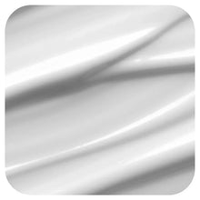 White cleanser cream texture in smooth streaks