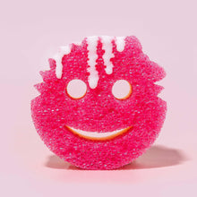 Pink smiling scrub sponge with two circular eyes and curved mouth cutouts