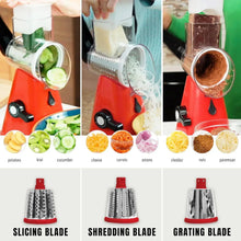 Red rotary cheese grater in use with grated vegetables and blade drum