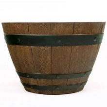 Brown wooden barrel planter with dark green stripe bands