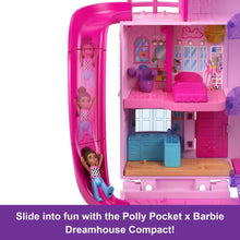 Pink and purple dollhouse interior with bed area, bathroom, and elevator opening