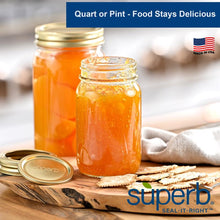 Wide-mouth glass canning jar with gold-tone lid, filled with orange preserve