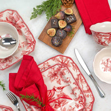 Round bowls and square plates with red holiday bird pattern