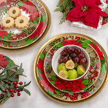 Holiday dinnerware plates with poinsettia, berries, and green leaves wreath design