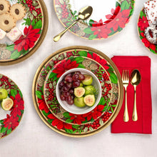 Holiday serving bowl and dinner plates with red poinsettia wreath and pinecone details