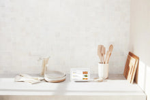 Chalk smart display on countertop with kitchen items around it