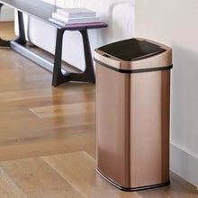 Gold stainless steel sensor trash can with open lid, front view
