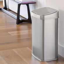 Stainless steel sensor trash can standing with closed lid, silver