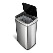 Stainless steel sensor trash can with open lid and dark inner compartment