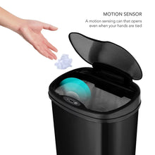 Black sensor trash can with open lid and motion sensor panel on the top