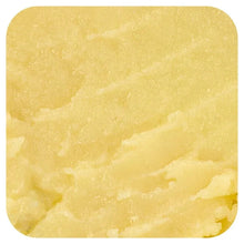 Pale yellow dog snout balm with smooth, glossy texture close-up