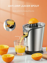 Stainless steel citrus juicer with anti-drip spout pouring yellow juice into a glass