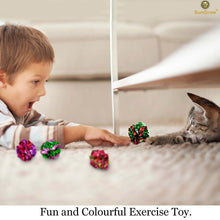 Cat with multicolor mylar crinkle balls as a child reaches across a couch