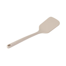 Beige silicone spatula with a flat paddle head and rounded edge