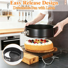 Black round springform cake pan with latch and detachable sides, around frosted cake.
