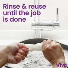 Paper towel in use at a sink, hands drying with a white towel sheet