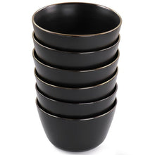 Stacked matt black stoneware bowls with gold rim, round serving bowl set