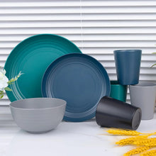 Teal and gray wheat straw dinnerware set with plates, bowl, and cup on table