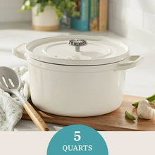 White enameled cast iron Dutch oven with lid and side handles