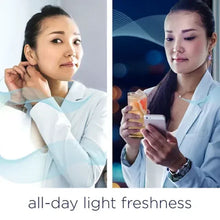 Downy Light scent booster beads bottle held by a person in a light blue shirt.