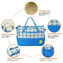 Blue patterned diaper tote bag with bear patch, side pockets, and dual zippers