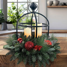 Evergreen holiday centerpiece with glowing LED candles in black metal lantern on table