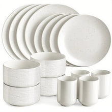 White stoneware dinnerware set with round plates and stackable mugs, speckled finish