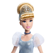 Cinderella doll close-up with blonde updo, jeweled tiara, blue choker, and sheer sleeves