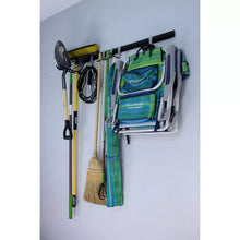 Wall utility storage rail with multiple hooks holding tools and gloves