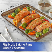 Reynolds Kitchens parchment sheet on baking pan with salmon and vegetables