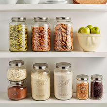 Ball mason jars with stainless lids, clear glass filled with grains and dry snacks