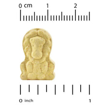 Chewable multivitamin tablet with size ruler, approx 0 to 1 inch.