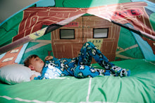 Treehouse pop-up play tent interior with open roof window; child lying inside