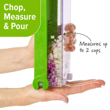 Green onion chopper with measuring chamber and pour spout, held by hands