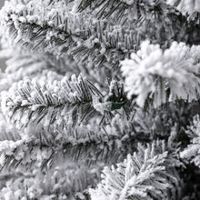 Flocked artificial Christmas tree branch tips with dense snow-texture